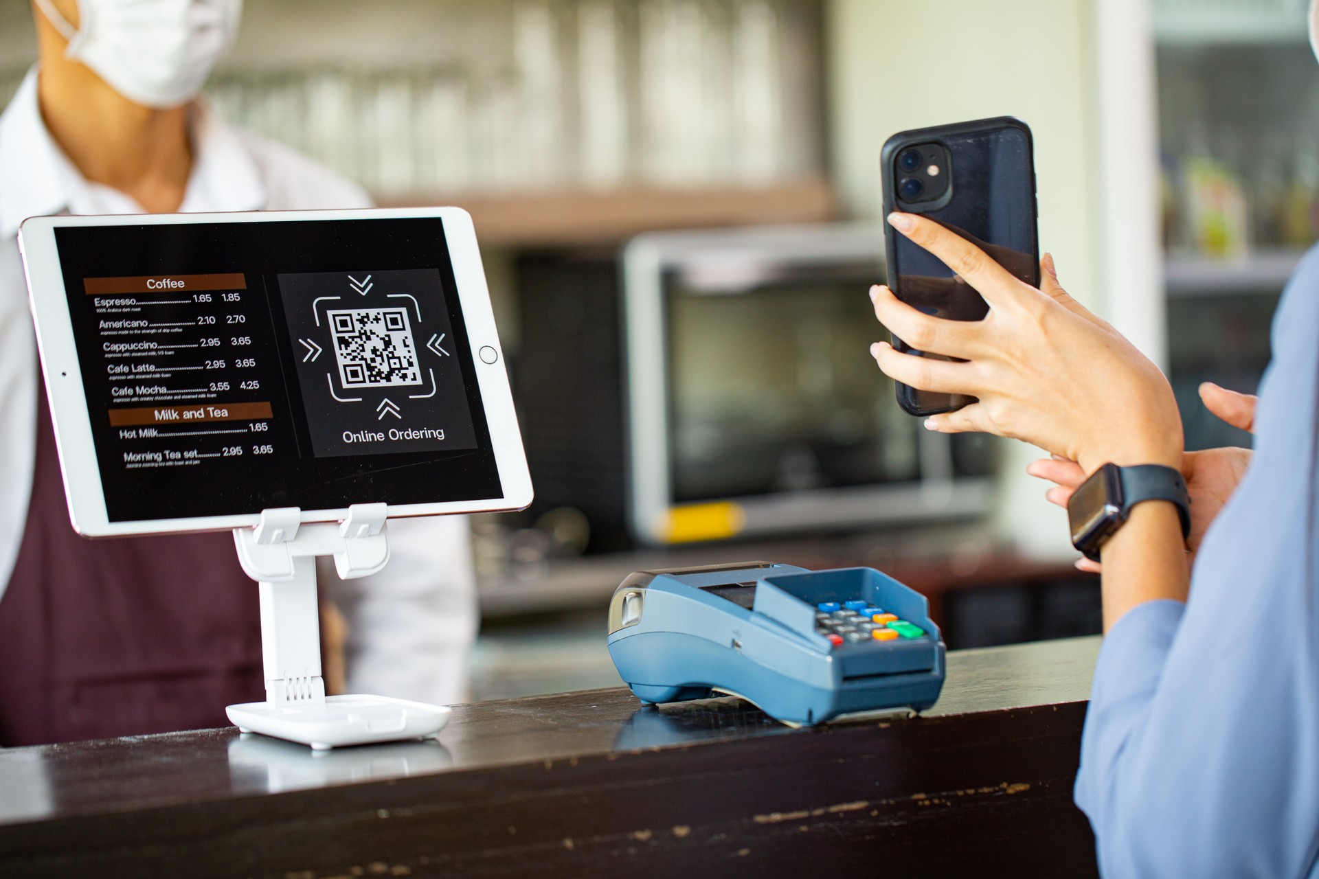 Customer using smartphone for payment with contactless